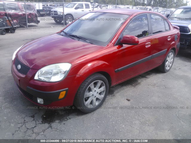 KNADE223896519245 - 2009 KIA RIO LX/SX RED photo 2