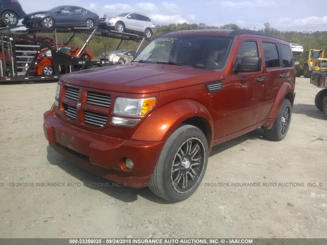 1D8GU58697W724769 - 2007 DODGE NITRO R/T ORANGE photo 2