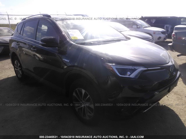 JTMRJREV9JD214864 - 2018 TOYOTA RAV4 HV LE PLUS/XLE BLACK photo 1