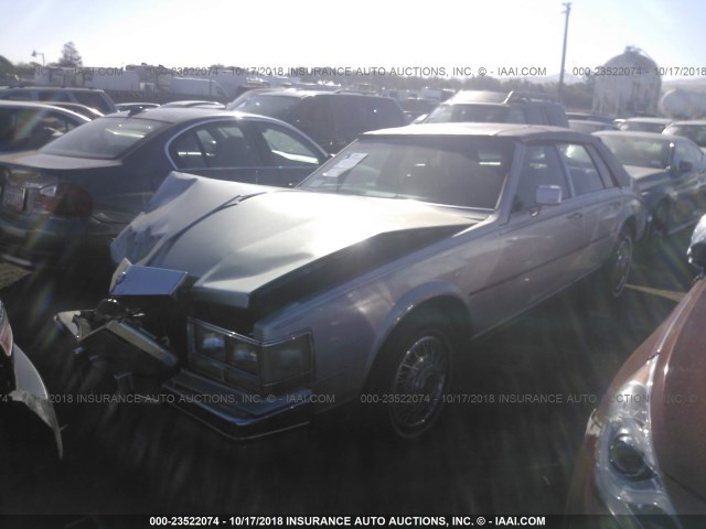 1G6KS6989FE839349 - 1985 CADILLAC SEVILLE SILVER photo 2