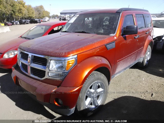 1D8GU58K97W555592 - 2007 DODGE NITRO SLT ORANGE photo 2