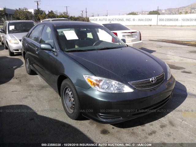 JTDBE32K330145581 - 2003 TOYOTA CAMRY LE/XLE GREEN photo 1
