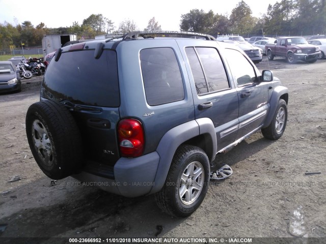 1J8GL48K02W187073 - 2002 JEEP LIBERTY SPORT BLUE photo 4