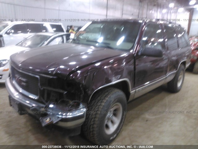 1GKEK13RXXJ712332 - 1999 GMC YUKON MAROON photo 2