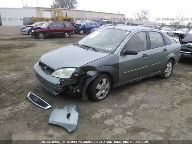 1FAFP34N95W315807 - 2005 FORD FOCUS ZX4 GREEN photo 2