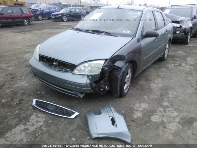 1FAFP34N95W315807 - 2005 FORD FOCUS ZX4 GREEN photo 6