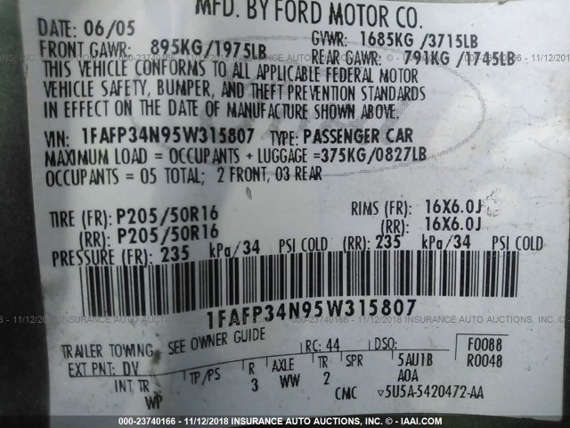 1FAFP34N95W315807 - 2005 FORD FOCUS ZX4 GREEN photo 9