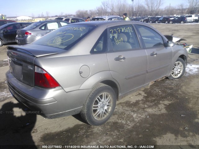 1FAFP34N25W209084 - 2005 FORD FOCUS ZX4 TAN photo 4