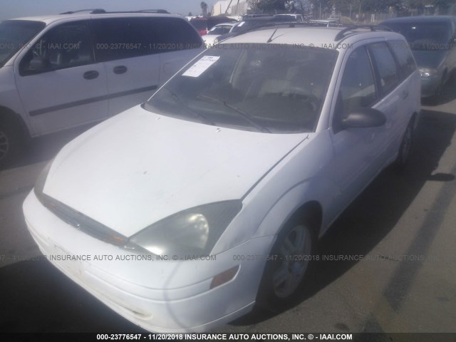 1FAFP36P5YW426275 - 2000 FORD FOCUS SE/SE COMFORT WHITE photo 2