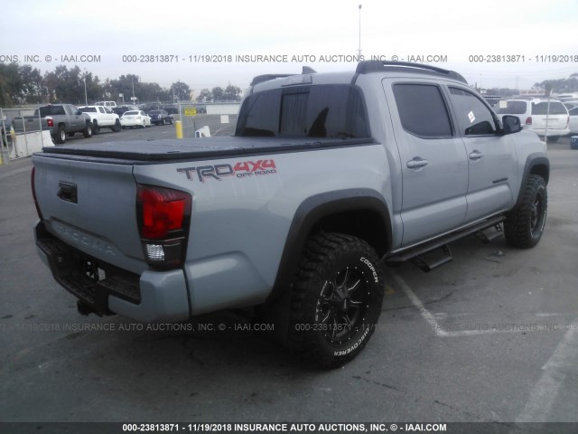 5TFCZ5AN3JX142815 - 2018 TOYOTA TACOMA DBL CAB/SR/TRDSPT/OR/PRO GRAY photo 4