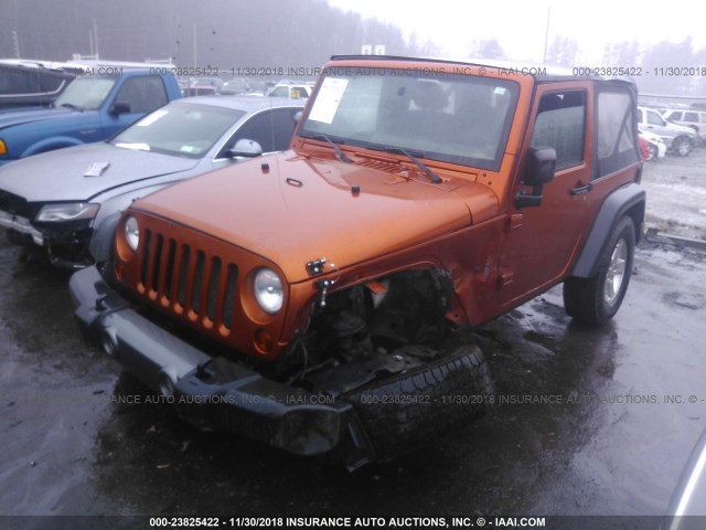 1J4AA2D10BL524261 - 2011 JEEP WRANGLER SPORT ORANGE photo 2