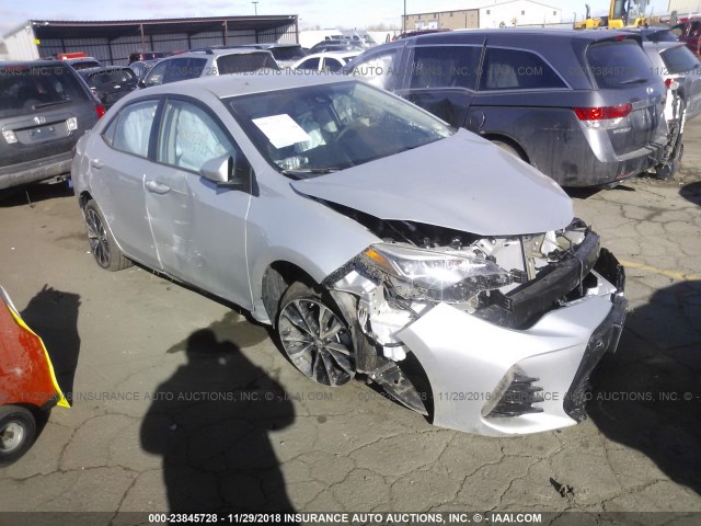 5YFBURHE6KP875318 - 2019 TOYOTA COROLLA L/LE/XLE/SE/XSE SILVER photo 1