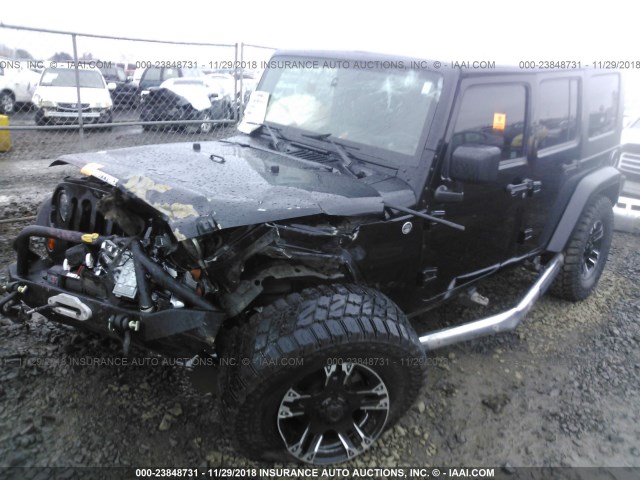 1J4BA5H14AL103688 - 2010 JEEP WRANGLER UNLIMITE SAHARA BLACK photo 2