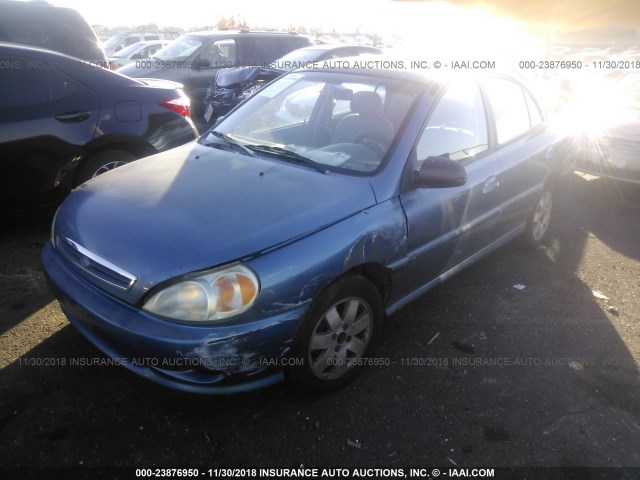 KNADC123126141372 - 2002 KIA RIO BLUE photo 2