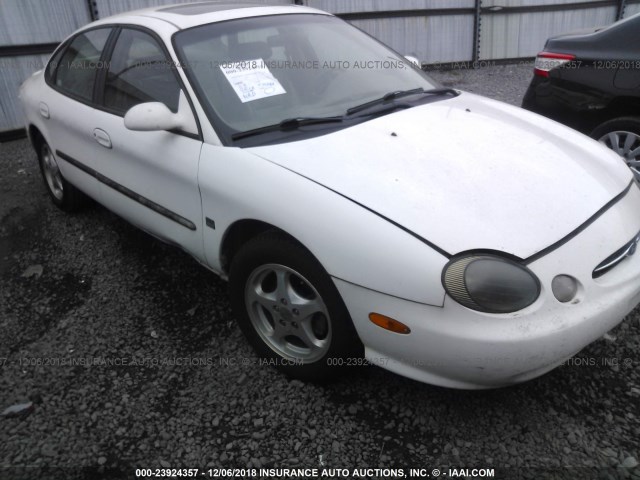 1FAFP53S9XA307869 - 1999 FORD TAURUS SE/COMFORT/SPORT WHITE photo 1