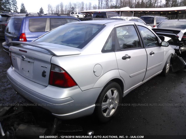 1FAFP34N25W133950 - 2005 FORD FOCUS ZX4 SILVER photo 4