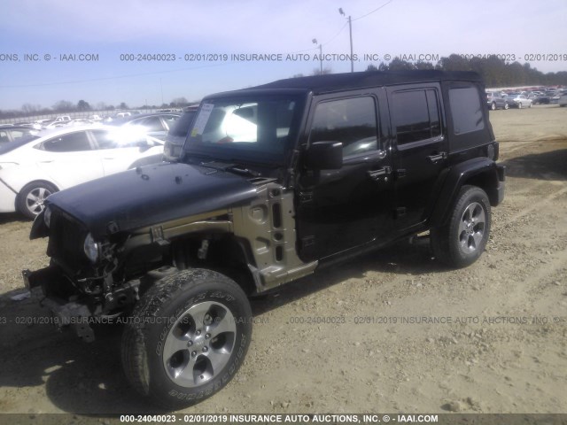 1C4BJWEG0DL543335 - 2013 JEEP WRANGLER UNLIMITE SAHARA BLACK photo 2