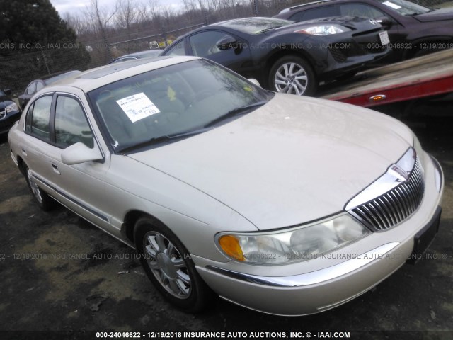 1LNHM97V51Y692512 - 2001 LINCOLN CONTINENTAL  GOLD photo 1