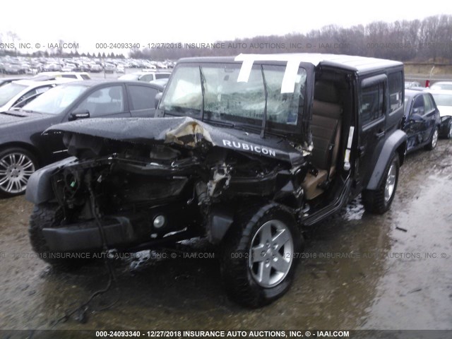 1J4BA6H13BL599560 - 2011 JEEP WRANGLER UNLIMITE RUBICON BLACK photo 2