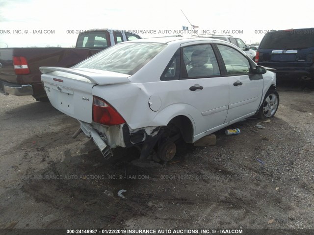 1FAFP34N35W186348 - 2005 FORD FOCUS ZX4 WHITE photo 4