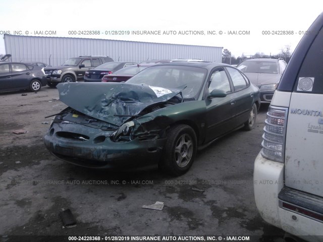 1FAFP53S6XA239451 - 1999 FORD TAURUS SE/COMFORT/SPORT GREEN photo 2