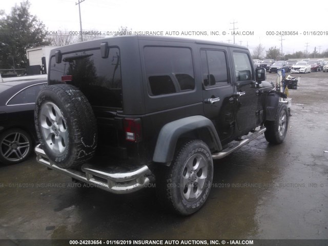 1J4HA6H13BL520320 - 2011 JEEP WRANGLER UNLIMITE RUBICON BLACK photo 4