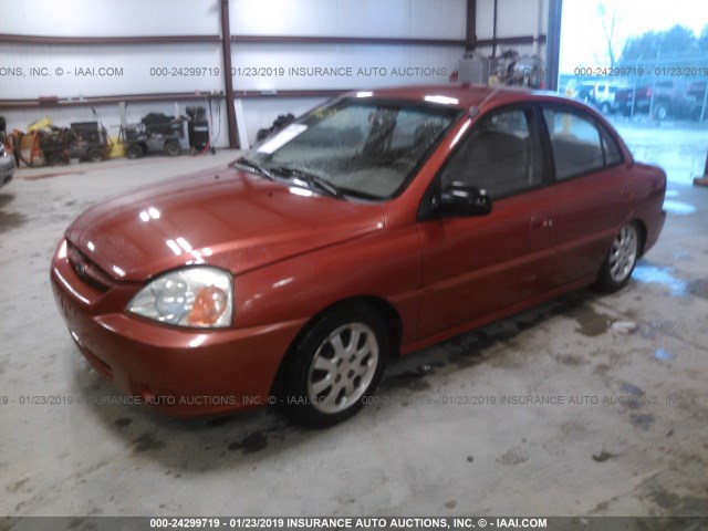 KNADC125546342406 - 2004 KIA RIO ORANGE photo 2