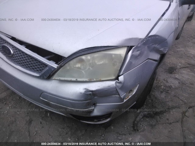1FAFP34N95W250604 - 2005 FORD FOCUS ZX4 GRAY photo 6