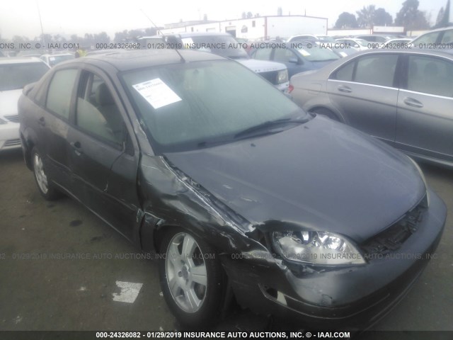 1FAHP34N05W178815 - 2005 FORD FOCUS ZX4 GRAY photo 1