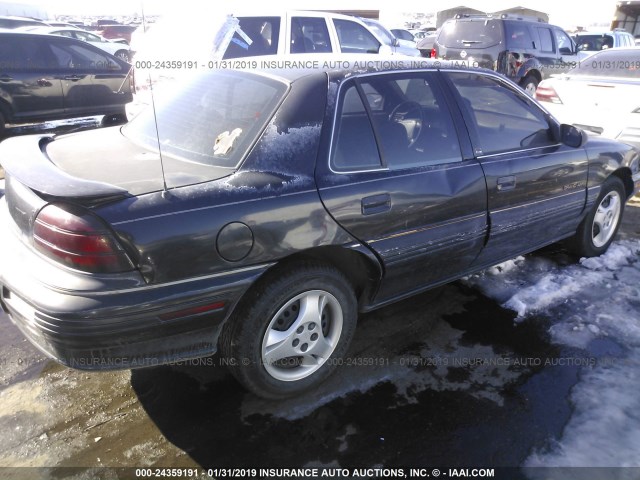 1G2NE55MXRC763160 - 1994 PONTIAC GRAND AM SE BLACK photo 4