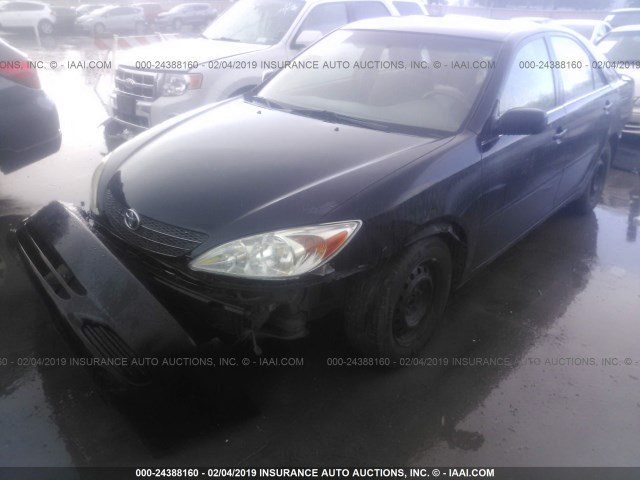 4T1BE30KX2U577087 - 2002 TOYOTA CAMRY LE/XLE/SE BLACK photo 2