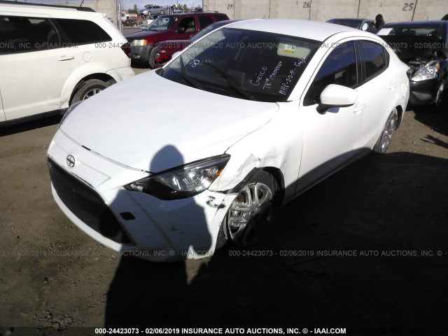 3MYDLBZV6GY112256 - 2016 TOYOTA SCION IA WHITE photo 6