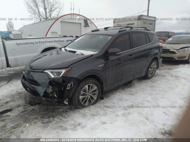 JTMRJREV6JD188577 - 2018 TOYOTA RAV4 HV LE PLUS/XLE GRAY photo 2