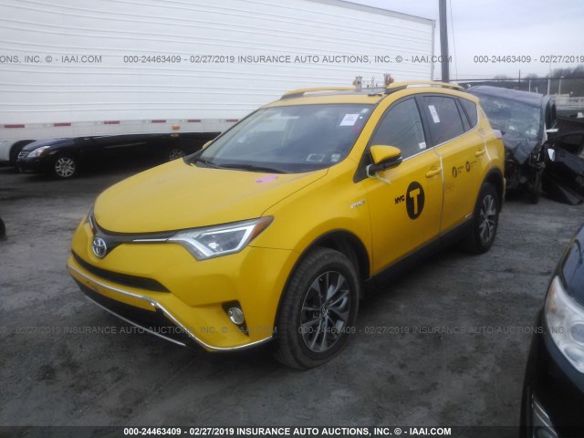 JTMRJREV9GD012454 - 2016 TOYOTA RAV4 HV XLE YELLOW photo 2