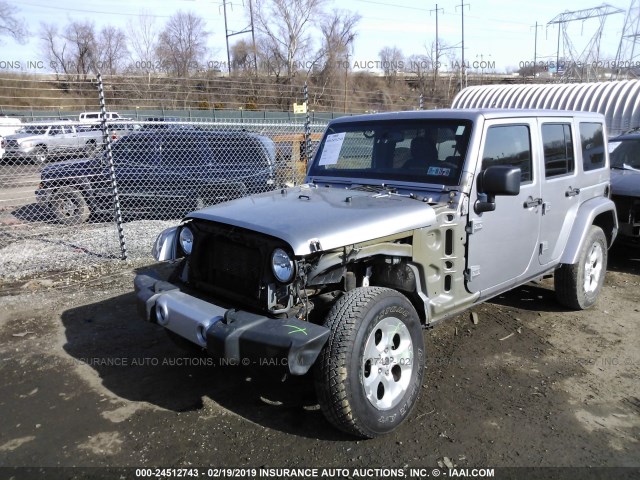 1C4HJWEG4EL247276 - 2014 JEEP WRANGLER UNLIMITE SAHARA SILVER photo 2