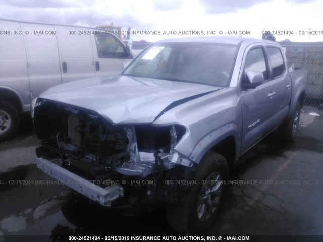 3TMAZ5CN2JM064585 - 2018 TOYOTA TACOMA DBL CAB/SR5/TRD SPORT/OR SILVER photo 2