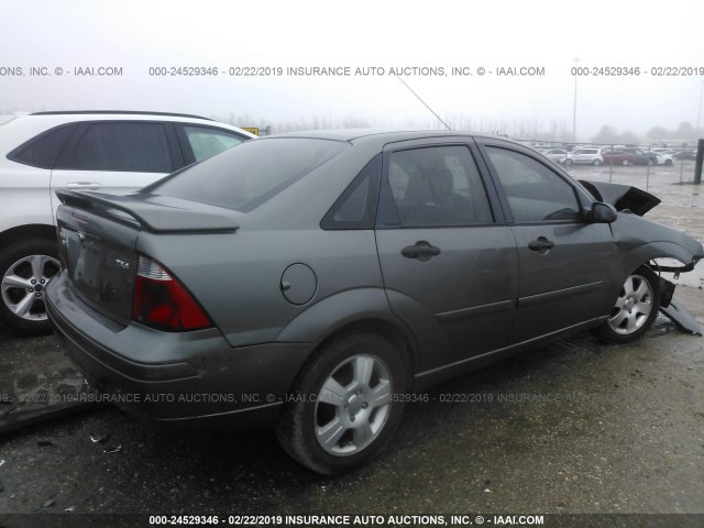 1FAFP34N45W232267 - 2005 FORD FOCUS ZX4 GRAY photo 4