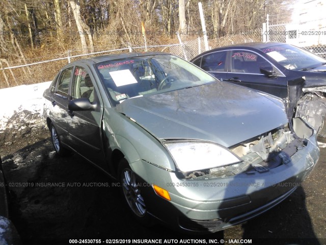 1FAFP34N15W274413 - 2005 FORD FOCUS ZX4 GRAY photo 1