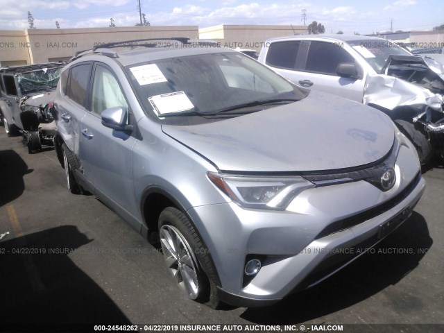 2T3YFREV9JW472723 - 2018 TOYOTA RAV4 LIMITED/PLATINUM SILVER photo 1