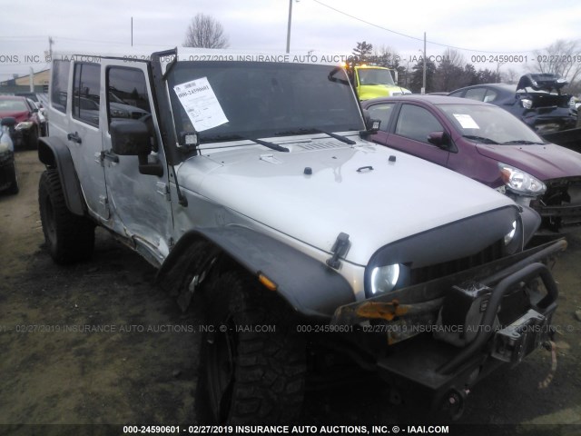 1C4HJWEG5CL132957 - 2012 JEEP WRANGLER UNLIMITE SAHARA SILVER photo 1