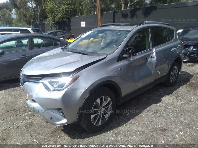 JTMRJREV4HD136374 - 2017 TOYOTA RAV4 HV LE/XLE SILVER photo 2