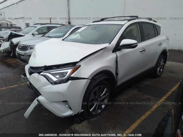 JTMDFREV9JJ748069 - 2018 TOYOTA RAV4 LIMITED/SE/PLATINUM WHITE photo 2