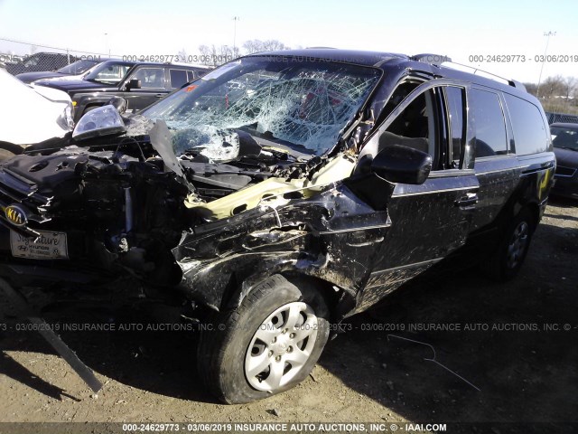 KNDMG4C37A6349570 - 2010 KIA SEDONA LX BLACK photo 2