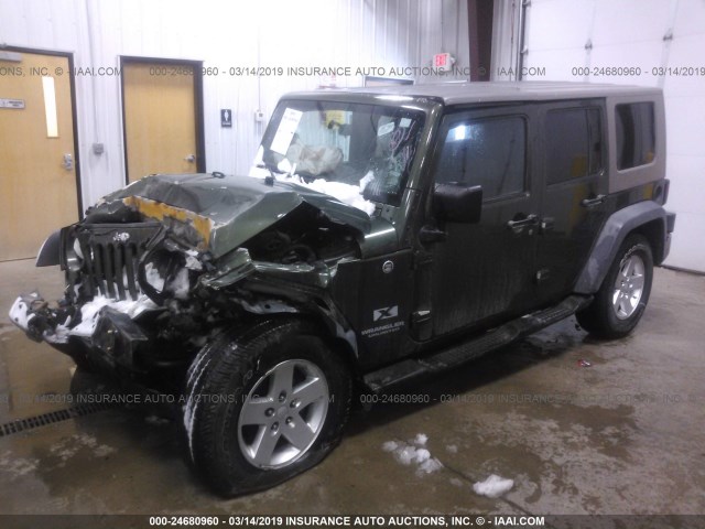 1J4GA39138L529763 - 2008 JEEP WRANGLER UNLIMITE X GREEN photo 2