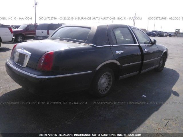 1LNHM81W5XY660941 - 1999 LINCOLN TOWN CAR EXECUTIVE BLACK photo 4