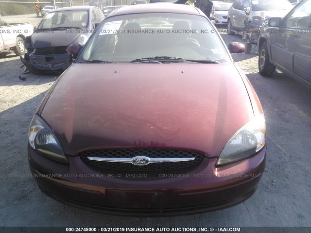 1FAFP55U3YG121323 - 2000 FORD TAURUS SES RED photo 6