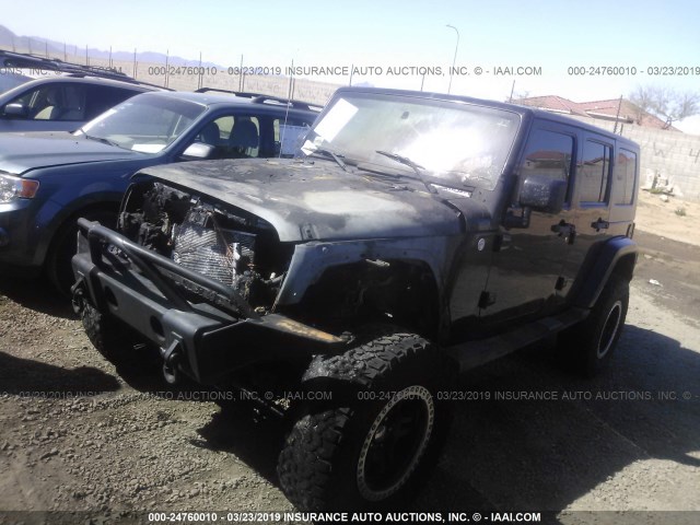 1J4BA5H16AL105586 - 2010 JEEP WRANGLER UNLIMITE SAHARA BLACK photo 2