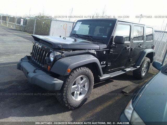 1J4GA39169L775806 - 2009 JEEP WRANGLER UNLIMITE X BLACK photo 2