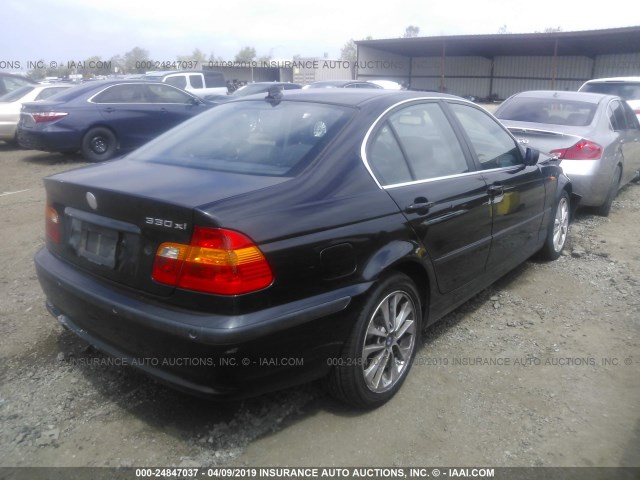 WBAEW53475PN37458 - 2005 BMW 330 XI BLACK photo 4