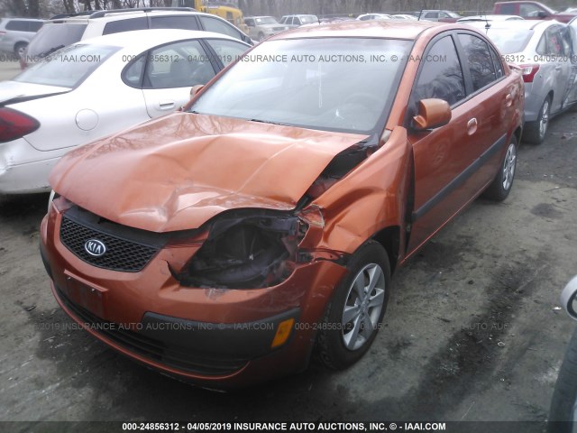 KNADE223996440375 - 2009 KIA RIO LX/SX ORANGE photo 2